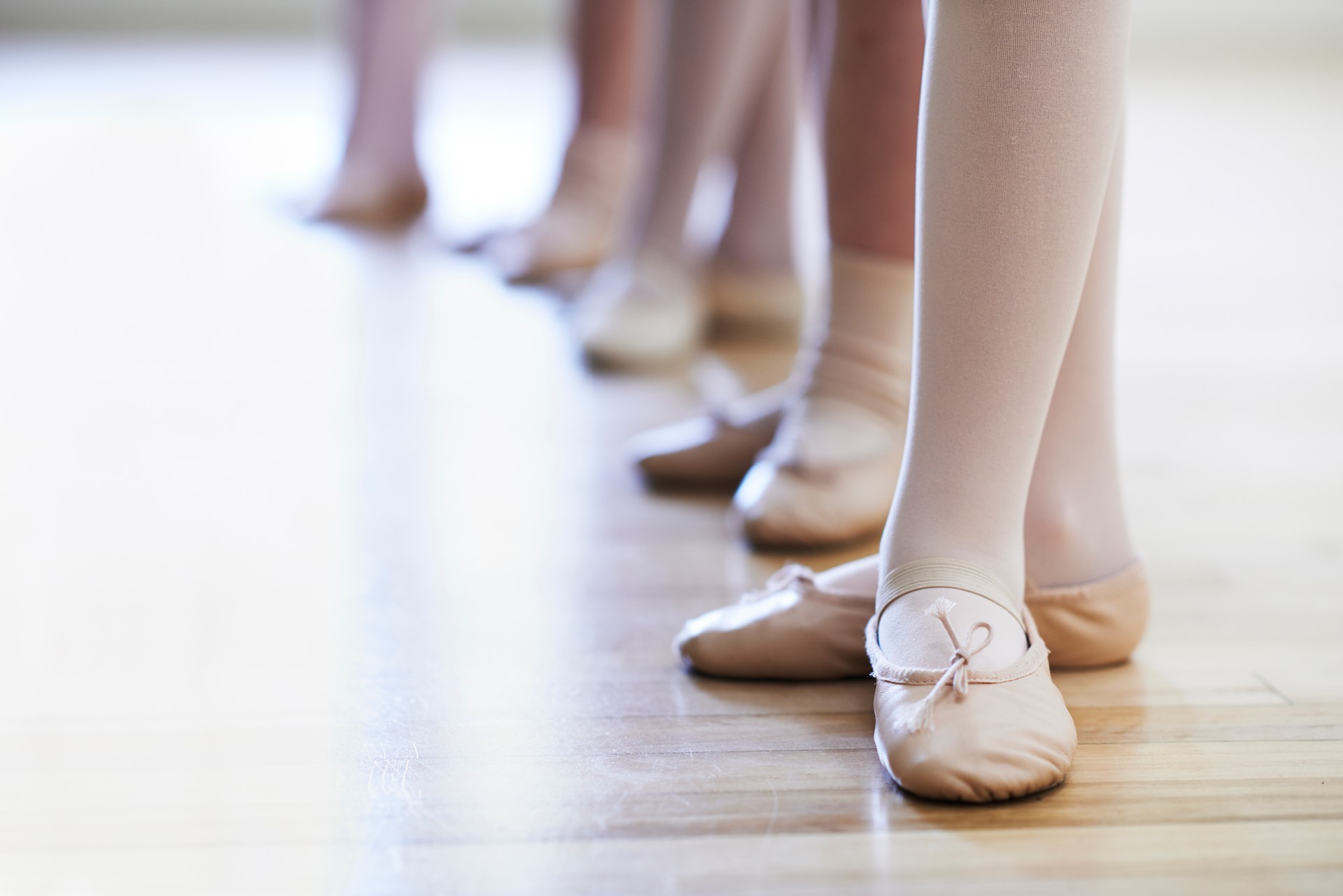 Close Up Of Feet In Children's Ballet Dancing Class